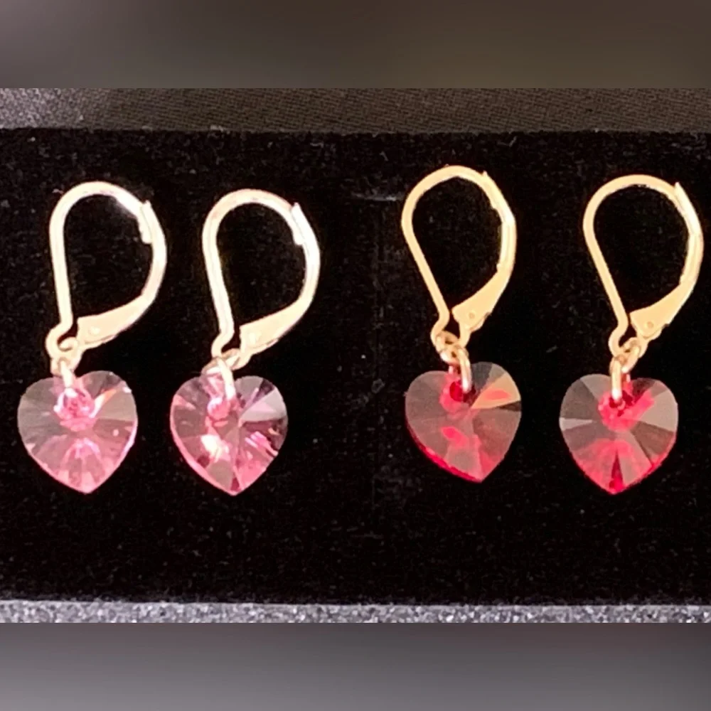 Set of two heart-shaped lever back earrings red and pink crystal